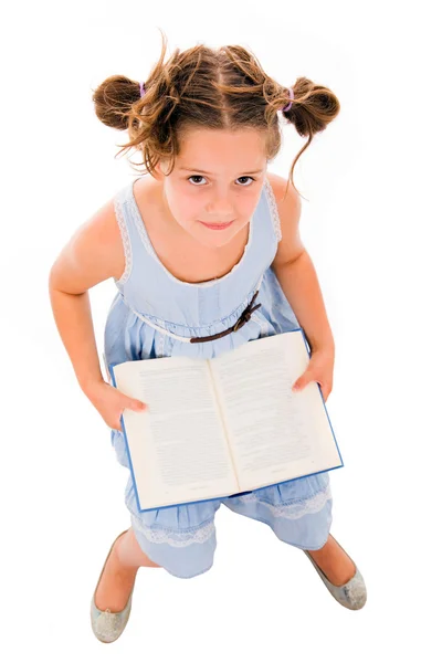 Top view of a adorable litle girl reading a book, isolated on wh — Stock Photo, Image