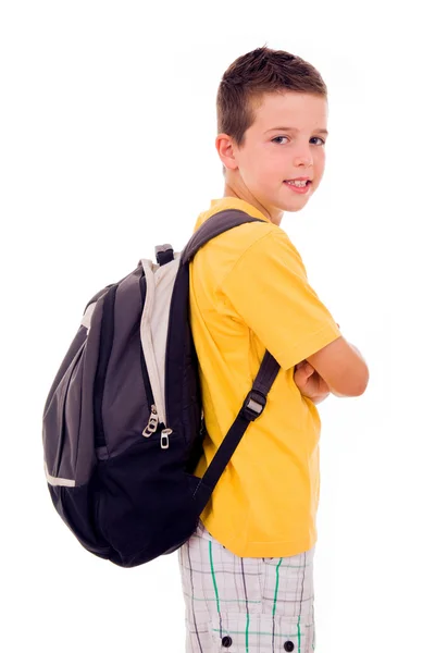 Portret van school jongen permanent met scholl tas, geïsoleerd op whi — Stockfoto