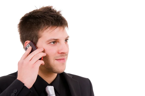 Side view of a young business man talking on the mobile phone, i — Stock Photo, Image