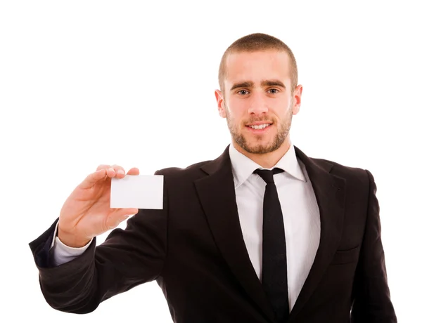 Joven hombre de negocios mostrando una tarjeta de visita en blanco sobre la espalda blanca —  Fotos de Stock