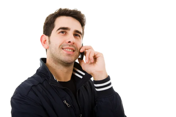 Close-up of a smiling young man on the phone, isolated on white — Stock Photo, Image