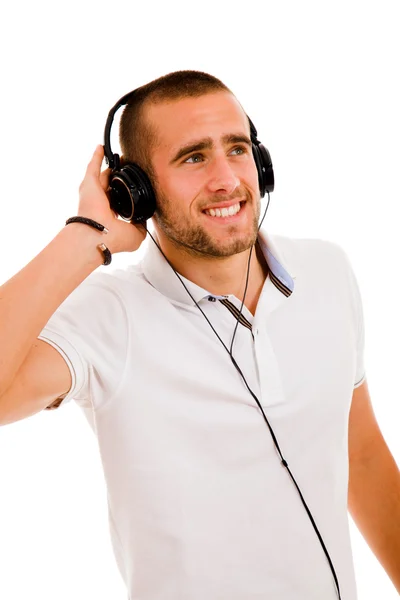Glücklicher junger Mann, der Musik hört. isoliert auf weißem Hintergrund. — Stockfoto