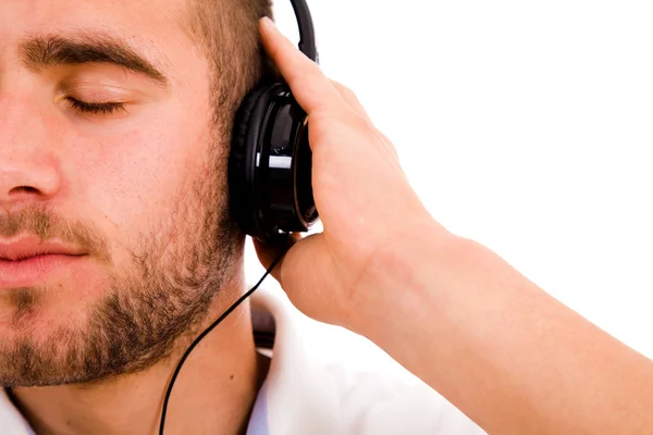 Młody człowiek słuchania muzyki. na białym tle. — Zdjęcie stockowe