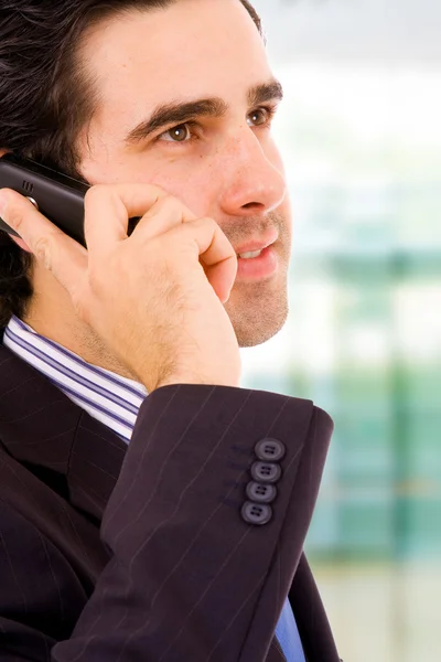 Close-up of a young handsome business man at the office building — Stock Photo, Image