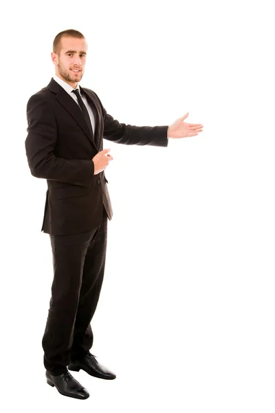 Hombre de negocios feliz con el brazo hacia fuera en un gesto de bienvenida, aislado — Foto de Stock