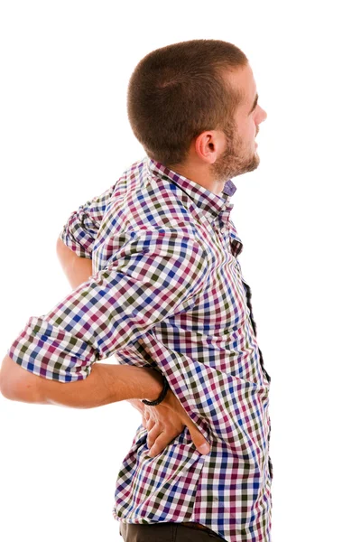 Mladý muž v agónii s bolestí zad, izolované na bílém — Stock fotografie