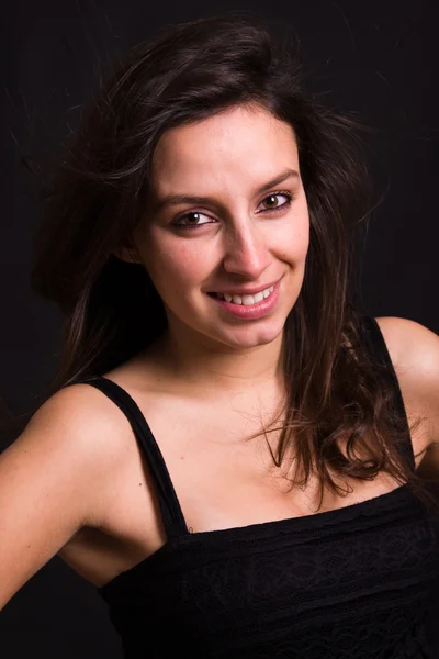 Studio portrait of a young fashion woman posing on a black backg — Stock Photo, Image