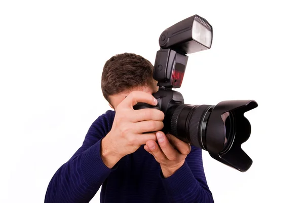 Professionele fotograaf met camera op witte achtergrond — Stockfoto