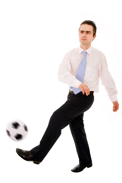 Empresário jogando com uma bola de futebol isolada em branco — Fotografia de Stock