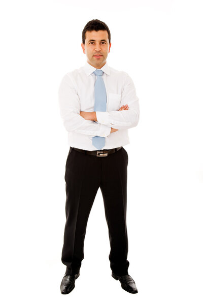 Full length portrait of a young businessman standing with his arms crossed on white background