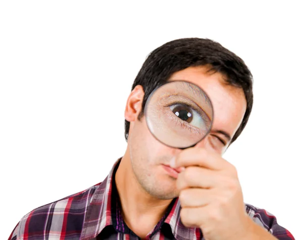 Funny image of a young man looking through magnifying glass. ( f — Stock Photo, Image