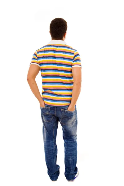 Young casual man full body from back with the hands in pockets , — Stockfoto