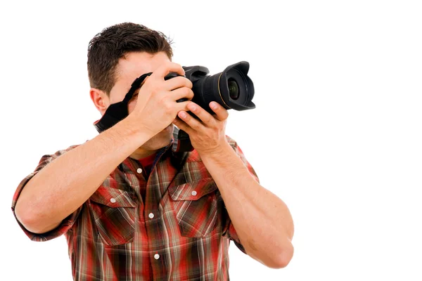 Jovem fotógrafo com câmera, isolado em branco — Fotografia de Stock