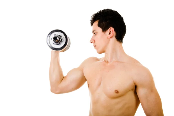 Poderoso muscular jovem levantando pesos — Fotografia de Stock