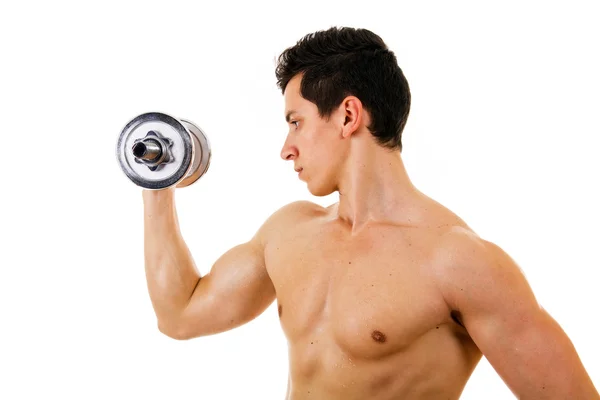 Profile view of a muscular young man lifting weights, isolated o — Stock Photo, Image