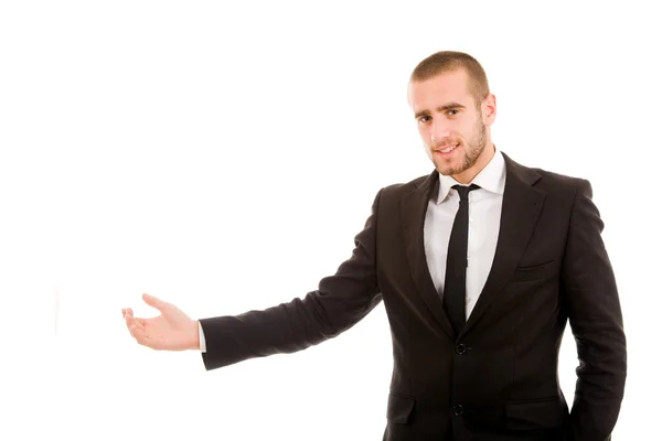 Happy young businessman with arm out in a welcoming gesture , is — Stock Photo, Image