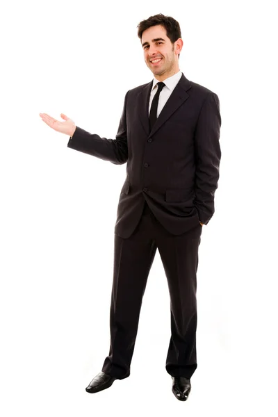 Smiling businessman with arm out in a welcoming gesture , isolat — Stock Photo, Image