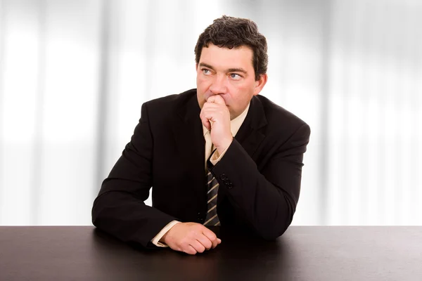 Mature business man on a desk at the office — Stock Photo, Image