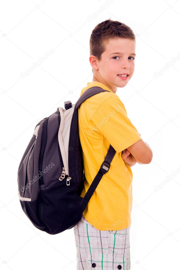 Portrait of school boy standing with scholl bag, isolated on whi