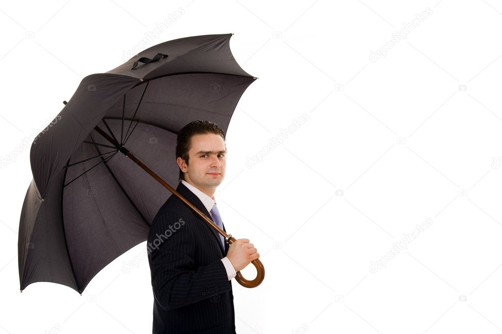 Young business man with an umbrella against white background