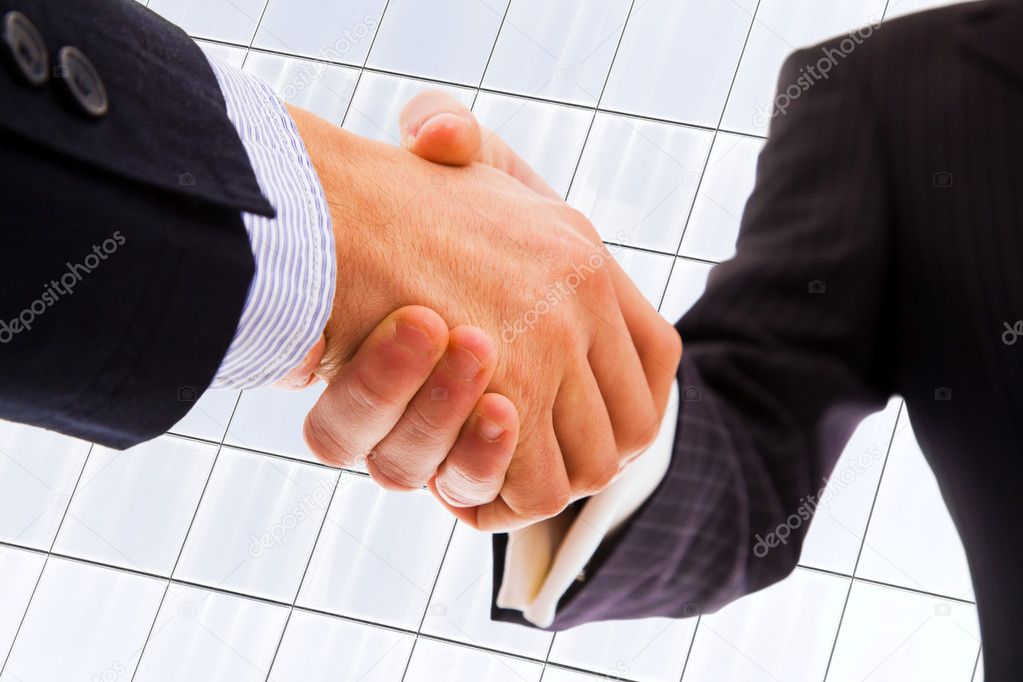 Closeup picture of businesspeople shaking hands, making an agree