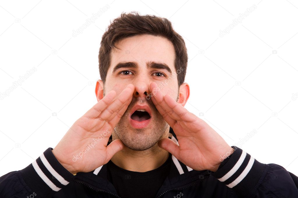 Portrait of a young man shouting loud with hands on the mouth, i