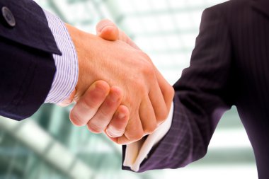 Business men hand shake at the office clipart