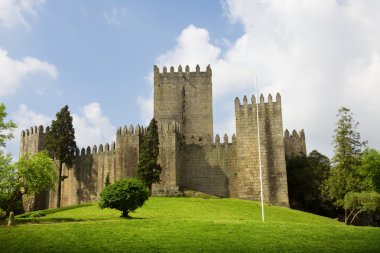 Guimaraes Castle, and surrounding park, in the north of Portugal clipart