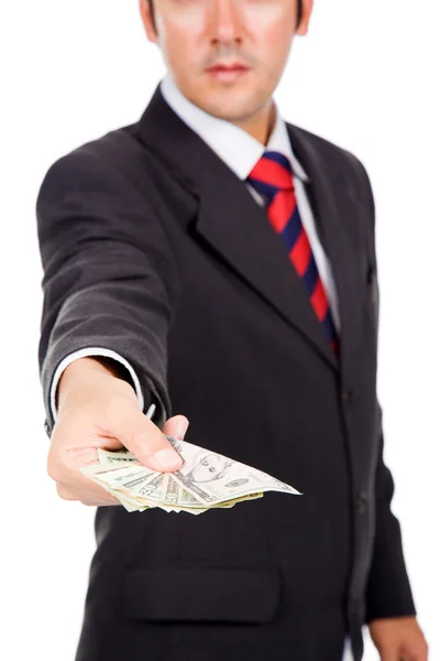 Imagem de um homem de negócios segurando, oferecendo dinheiro, isolado no whit — Fotografia de Stock