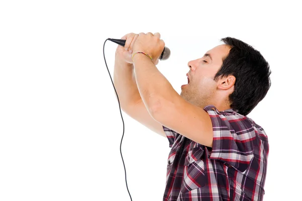 Image of a handsome young man singing to the microphone, isolate — Stock Photo, Image
