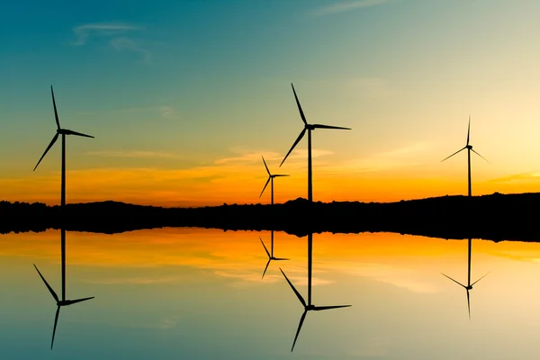 Windmills silhouette on suset background — Stock Photo, Image