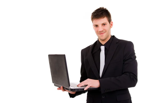 Jovem homem de negócios que trabalha com é laptop — Fotografia de Stock
