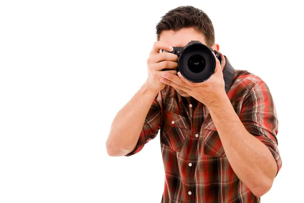 Joven fotógrafo con cámara, aislado en blanco — Foto de Stock