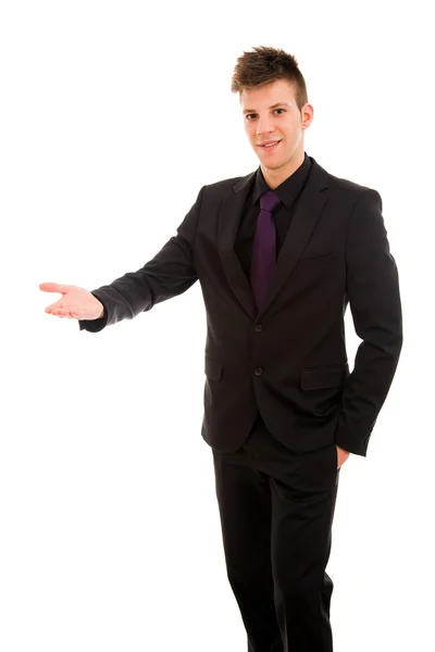 Hombre de negocios feliz con el brazo hacia fuera en un gesto de bienvenida, aislado —  Fotos de Stock