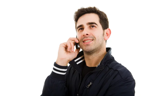 Bliska uśmiechający się młody człowiek w telefonie, na białym tle — Zdjęcie stockowe