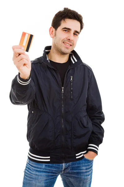 Joven feliz sosteniendo tarjeta de crédito, aislado en blanco — Foto de Stock