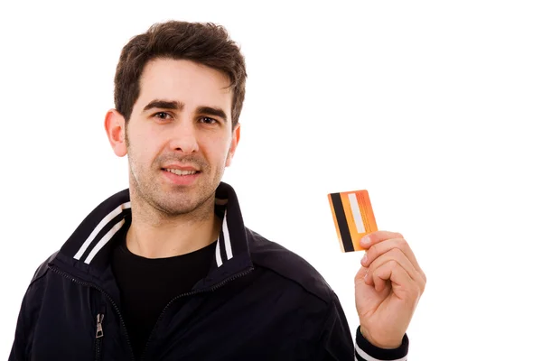 Ευτυχής νέος άνθρωπος που κρατά την πιστωτική κάρτα, που απομονώνονται σε λευκό — Φωτογραφία Αρχείου