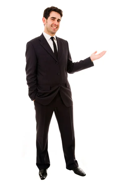 Lächelnder Geschäftsmann mit ausgestrecktem Arm in einer einladenden Geste, isolat — Stockfoto