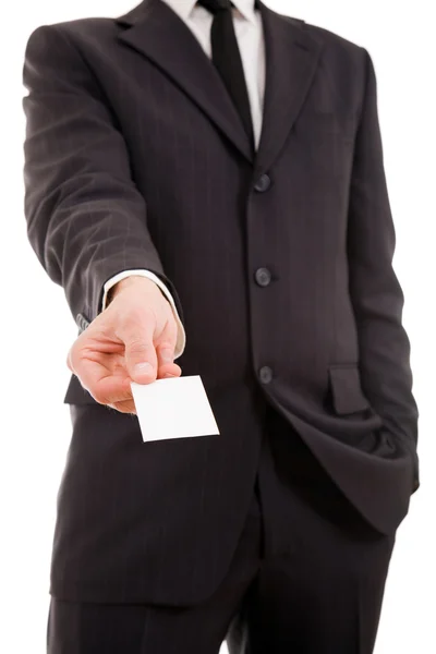 Empresario entregando una tarjeta de visita en blanco sobre fondo blanco — Foto de Stock