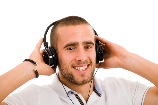 Giovane uomo che ascolta musica isolata su bianco — Foto Stock