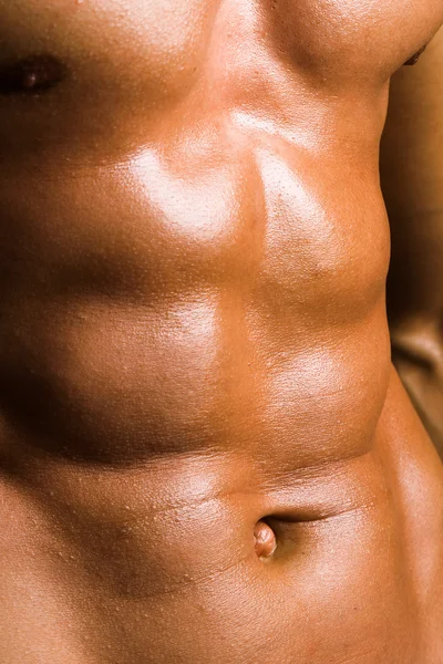 Nahaufnahme des perfekten männlichen Oberkörpers, der Bauchmuskeln eines Bodybuilders — Stockfoto