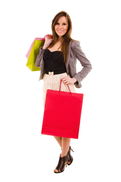 Happy young beautiful woman out of shopping with colored bags — Stock Photo, Image
