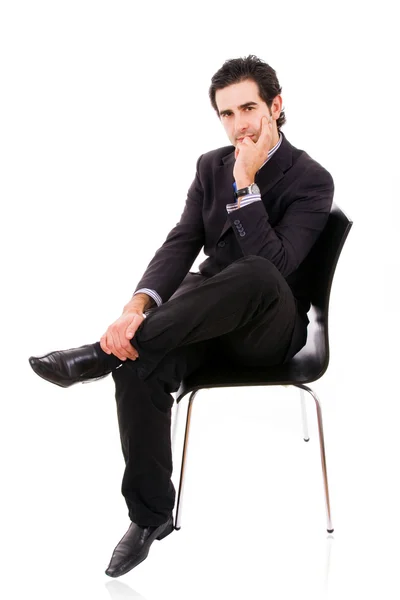 Relaxed business man sits on office chair over white background — Stock Photo, Image