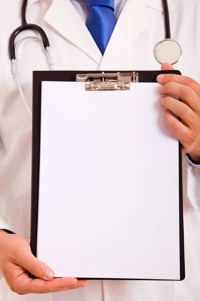 Doctor showing blank clipboard — Stock Photo, Image