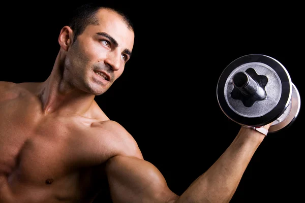 Musculoso hombre levantando pesas — Foto de Stock