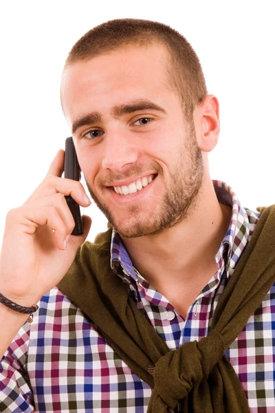 Szczęśliwy młody człowiek za pomocą telefonu komórkowego — Zdjęcie stockowe