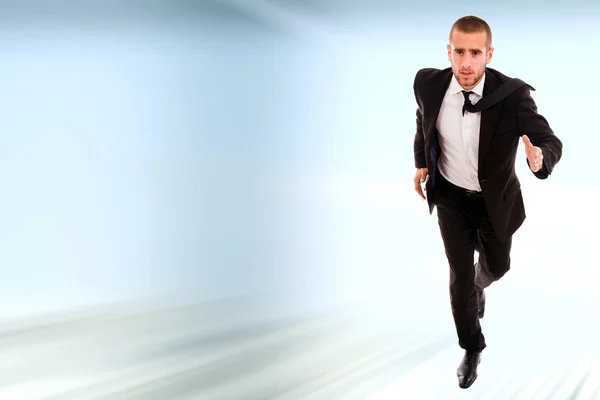 Молодий бізнесмен біжить — стокове фото