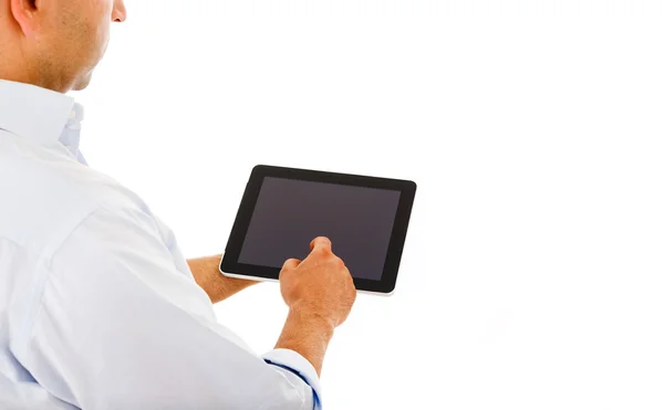 Yakışıklı bir adam bir tablet bilgisayar kullanma — Stok fotoğraf