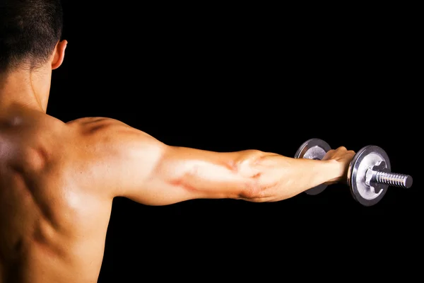 Bakifrån av en ung manlig bodybuilder — Stockfoto