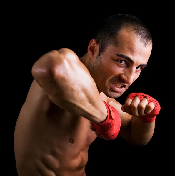 stock image Young Boxer fighter over black background